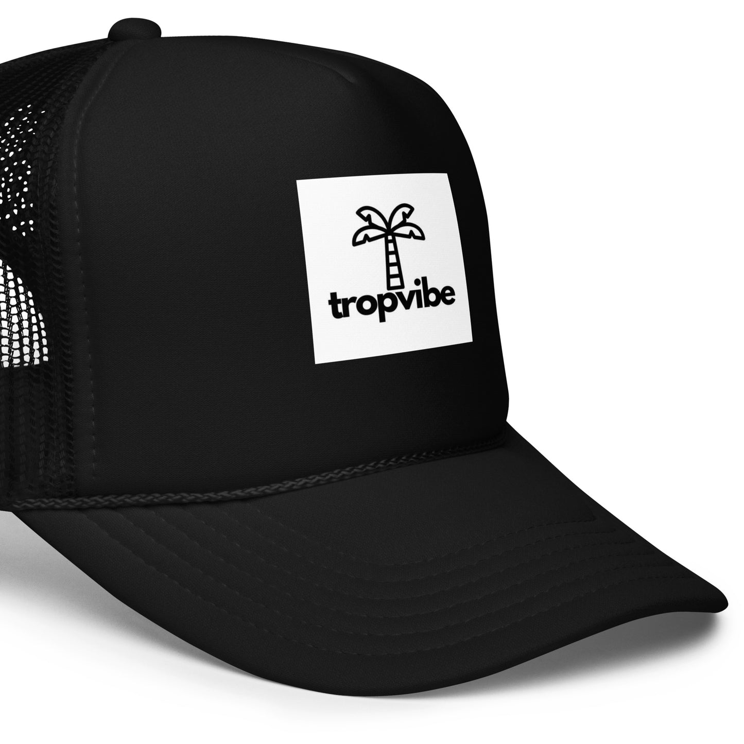 Black trucker cap with 'tropvibe' logo on a white background